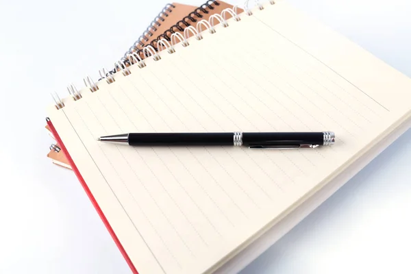 Open book with blank pages and pen on white background — Stock Photo, Image