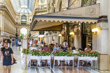 MILAN, ITALY - JUNE 27, 2018: Luxury Italian Restaurant  in Galleria Vittorio Emanuele II -  the Most Popular Shopping Mall in Milan.