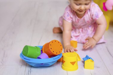 Baby Girl Playing with Colorful Educational Toy