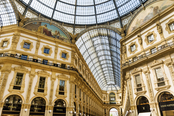 MILAN, ITALY - JUNE 27, 2018: Luxury Stores in Galleria Vittorio Emanuele II -  the Most Popular Shopping Mall in Milan.