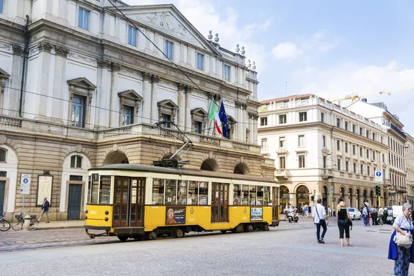 MILAN,ITALY -JUNE 27,2018 :Historic Tram on the Street in Milan,Italy .Street Traffic with Yellow Trolley Car