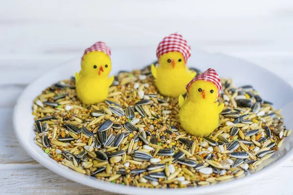 Dried Grains Bird Food with Black Sunflower Seeds and Yellow Chicken Toys