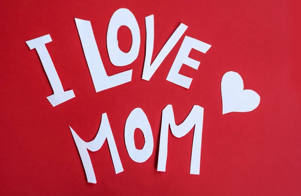 I love mom sign with white words on a red background