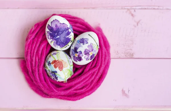 Pink Easter Eggs  on a  Pink Wooden Background. Easter Decoration.  Decoupage ideas .