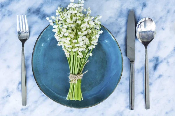 Bouquet of Lily of the Valley and Cup of Coffee for  Good Morning .Spring Morning Concept