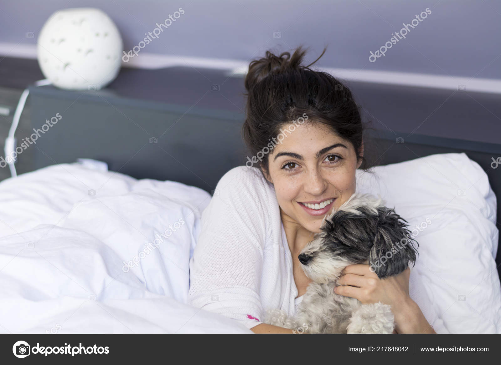 Woman Hugging Her Sleeping Dog Bed Stock Photo by ©brnmanzurova.gmail
