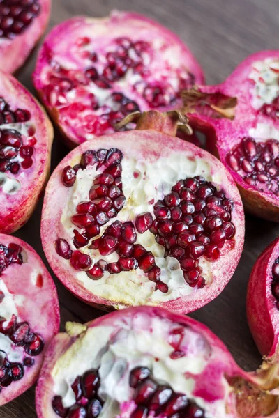 Red juice pomegranates on background