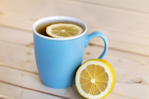 blue cup of tea with lemon