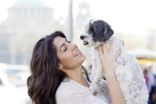Beautiful Smiling Woman Hugging  Her Cute Havanese Dog .Pet and Owner Outdoor