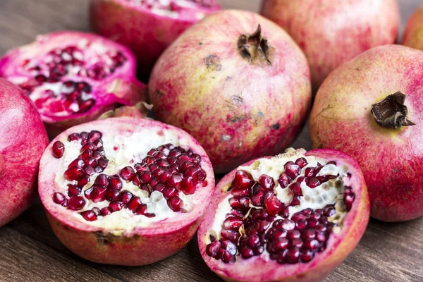 Red juice pomegranates on background