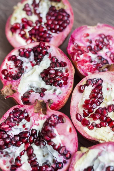 Red juice pomegranates on background