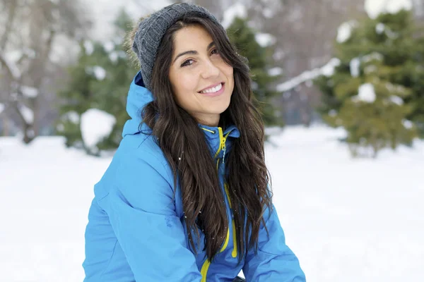 Beautiful Smiling Young Woman in a Winter Snowy Mountain .Winter Holidays