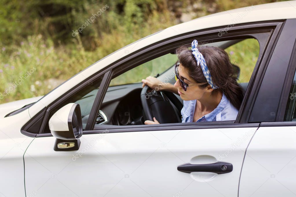 Young Woman Parking a Car