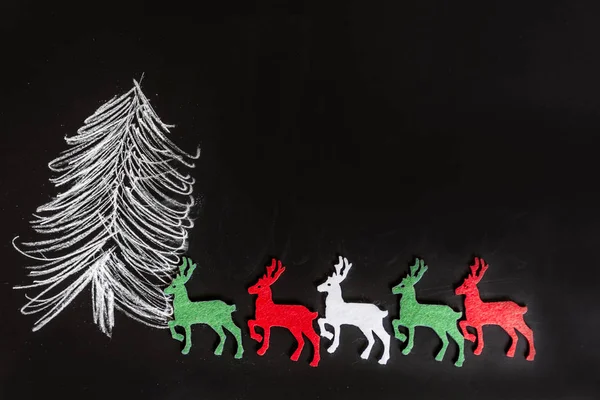 Christmas Tree Drawing and Deers on Black Chalkboard