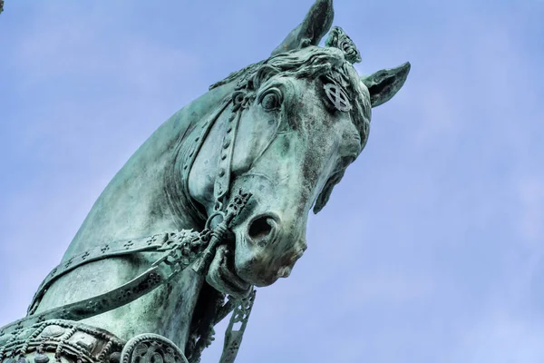 Close up of Horse Statue of Bronze on a Blu Sky Background