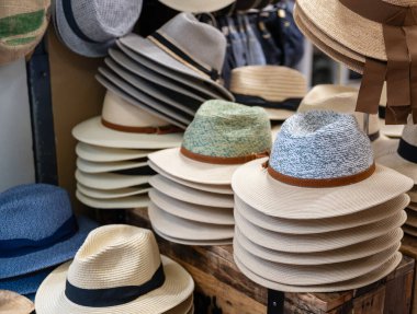 Stacks of straw  hats in hat store 