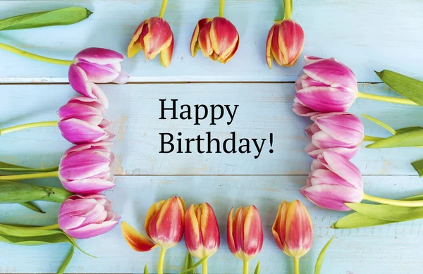 https://st4.depositphotos.com/19600372/i/600/depositphotos_216980016-stock-photo-happy-birthday-message-tulips-frame.jpg