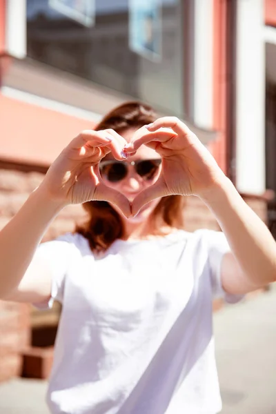 Happy young woman on the street.