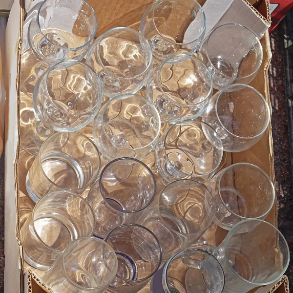 Many drinking glasses collection in crate