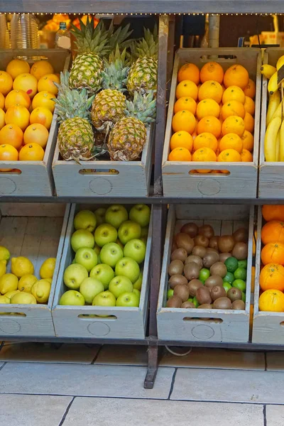 Crates with fresh fruits in healthy shop