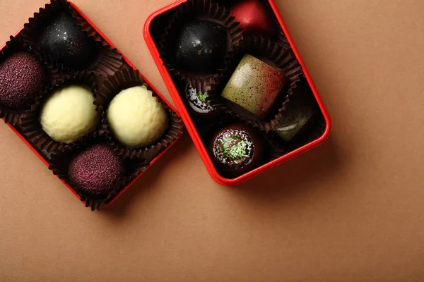 Chocolate candies in gift box, food above