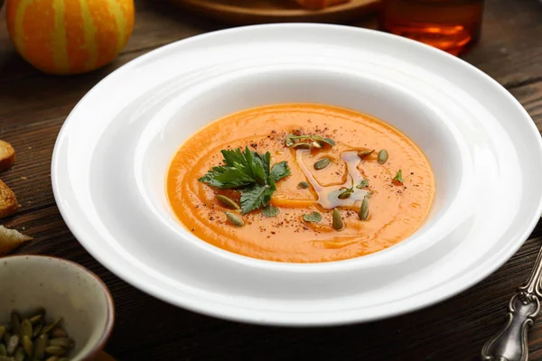 Pumpkin soup in white plate, food closeup — Stock Image Pumpkin Soup White Plate Food Closeup Royalty Free Stock Images