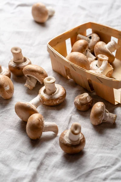 Fresh brown mushrooms in wooden box