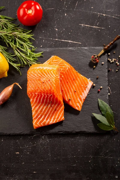 Two slice of salmon fish on slate — Stock Photo, Image