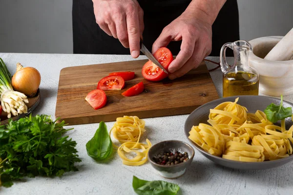 Hands Chopping Tomato Pasta Cooking — Stock Photo, Image