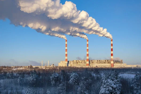 Thermal power plant. Bright chimneys against a very blue beautiful sky. Concept: ecology, cleanliness, industry, electricity.