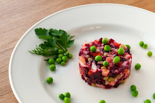 Vegetarian dish. Vinaigrette of avocado, carrots, beets, sauerkraut, green peas and vegetable oil.