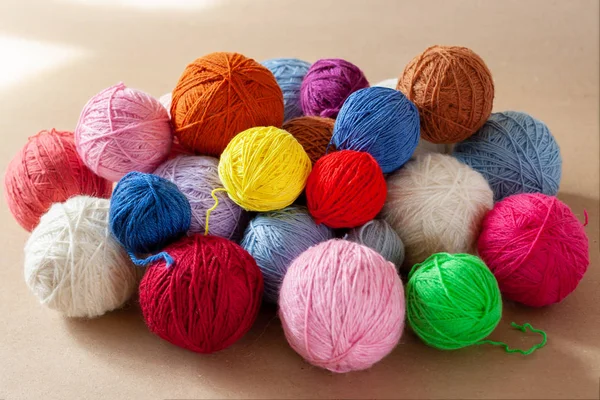 A bunch of colorful yarn balls.