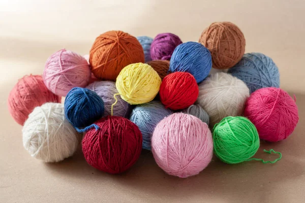 A bunch of colorful yarn balls.