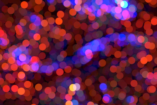 Bright night background with bokeh. Bright colored bubbles.