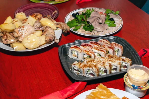 Potato and meat dishes, fish dishes and sushi are served on the