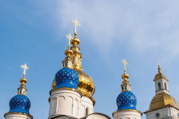 Domes and crosses of the Orthodox Church against the blue sky.