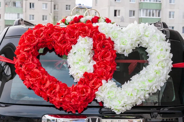 The symbol of love is Two hearts on the wedding car. Double hear