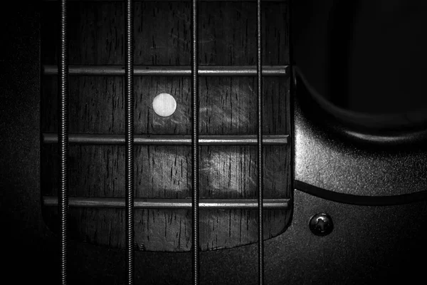 Closeup monochrome Bass Guitar Instrument Fret Board And Strings