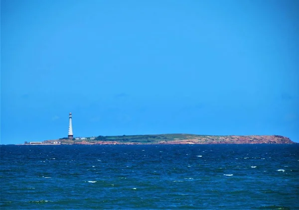 Nature landscape. Coast with lighthouse.