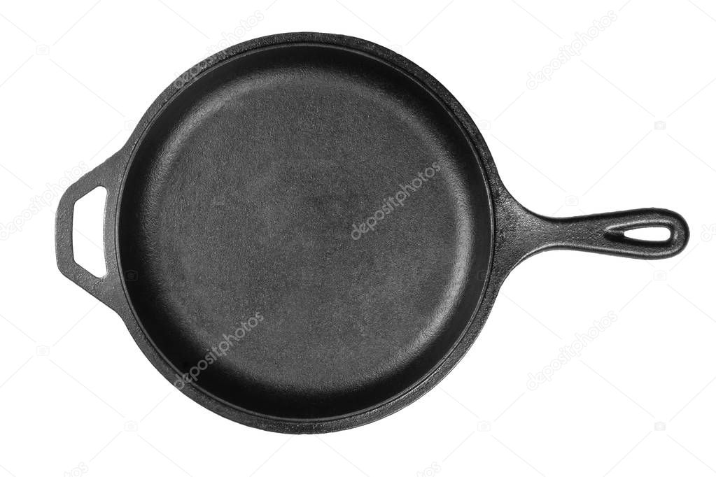 Empty, clean black cast iron pan or dutch oven top view from above over white background