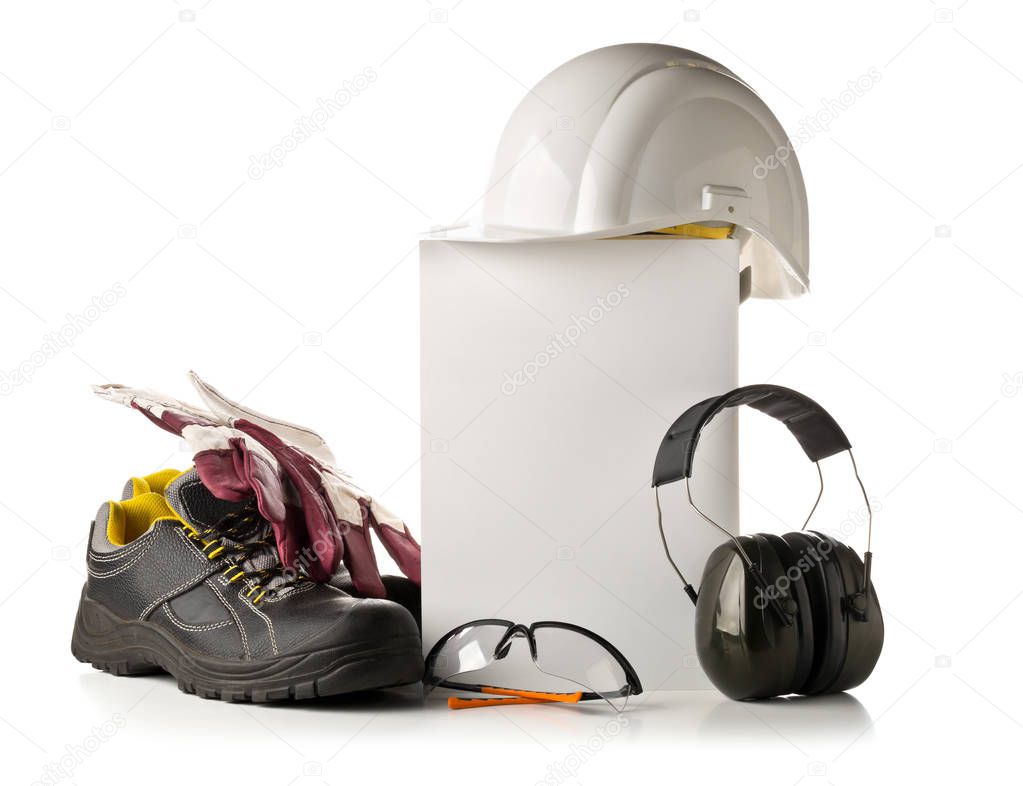 Work safety and protection equipment - protective shoes, safety glasses, gloves and hearing protection over white background with blank card for copy