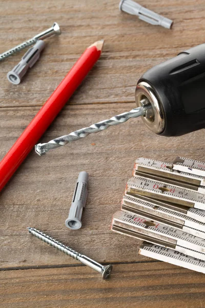 Wall Plug Dowel Screw Electric Power Drill Folding Rule Pencil — Stock Photo, Image