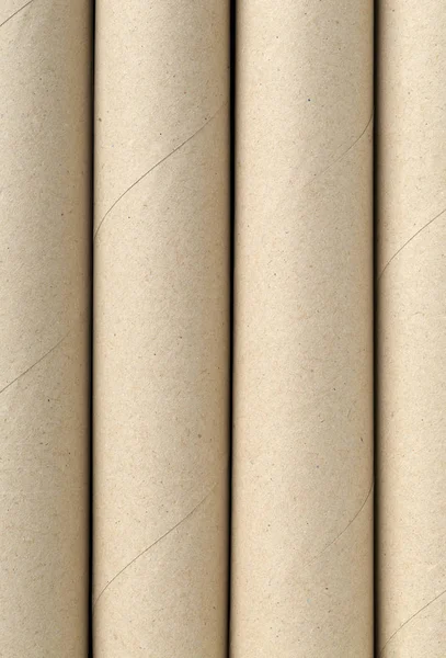 Four Empty Used Brown Cardboard Roll Tubes Background Filling Texture — Stock Photo, Image