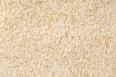 Yukarıdan doku arka plan düz doldurarak isabgol çerçeve olarak da adlandırılan psyllium kabuğu yatıyordu. İsabgol olarak da bilinir psyllium kabuğu Hindistan'da bulunan dar ovata bitkisinin tohumlarından elde edilen lif olduğunu. Yukarıdan düz yatıyordu.