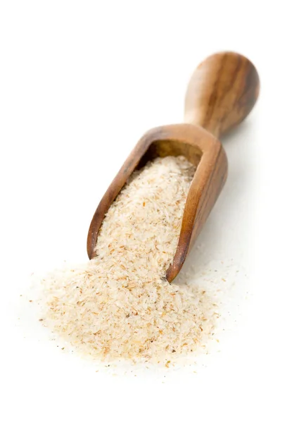 Heap of psyllium husk also called isabgol in wooden scoop over w — Stock Photo, Image