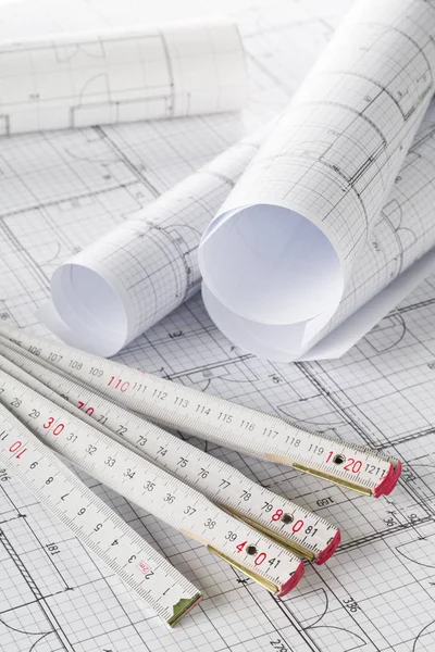 Rolls of architectural blueprint house building plans with foldi — Stock Photo, Image