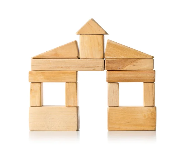 House build from wooden building block pieces over white — Stock Photo, Image