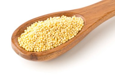 Altın darı yığını, bir glutensiz tahıl tohumu, tahta kaşık