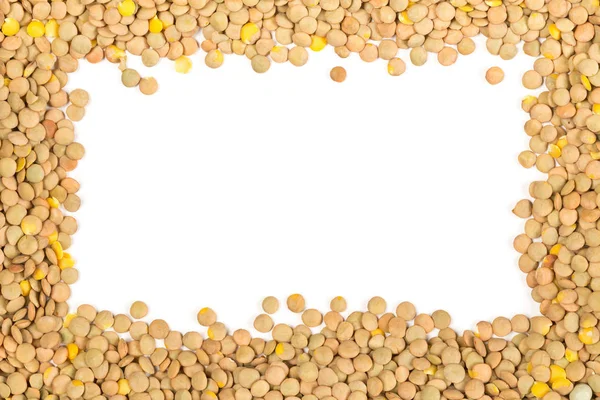 Raw, dry, uncooked brown lentil legumes frame border texture bac — Stock Photo, Image