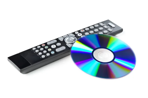 DVD, CD-ROM or Blu-Ray disc with tv or disc player remote contro — Stock Photo, Image